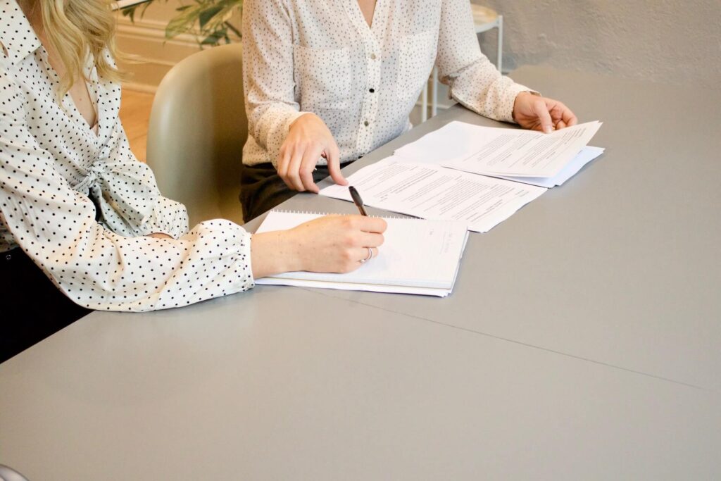 woman signing documents