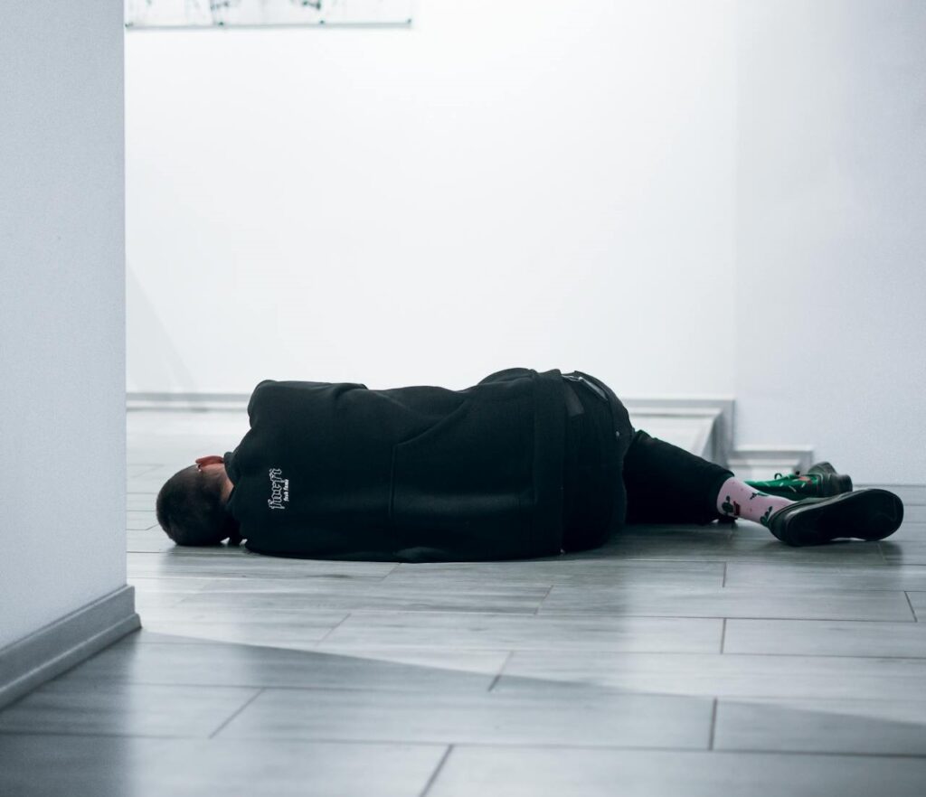 a man sleeping on the floor